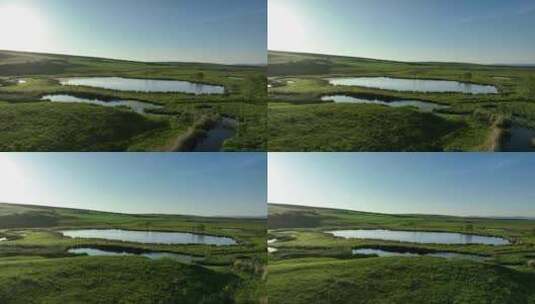 航拍呼伦贝尔夏日湿地湖泊风光高清在线视频素材下载