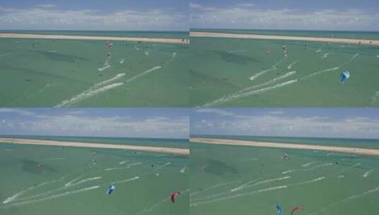 夏日海滩度假背景。风筝冲浪者在巴西海岸享受绿松石色的水。高清在线视频素材下载