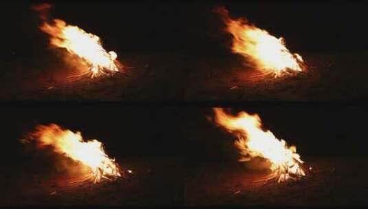 4k实拍黑夜火堆光亮火焰木材森林野炊露营夏高清在线视频素材下载