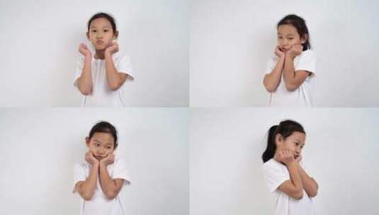 在白色背景前做各种表情的亚洲女孩高清在线视频素材下载
