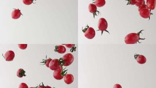 慢镜头拍摄空中掉落的新鲜有机小番茄高清在线视频素材下载