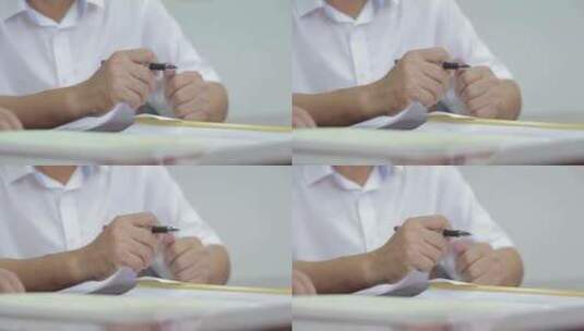 男人手里握着的钢笔高清在线视频素材下载