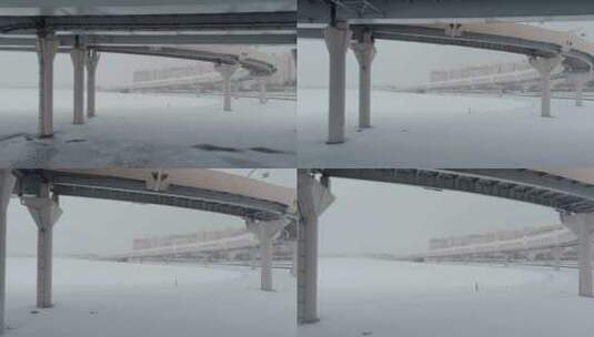 无人机在暴雪高速公路上沿着斜拉桥飞行暴雪娱乐高清在线视频素材下载