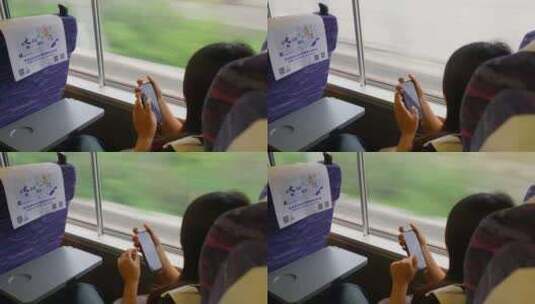 靠在列车窗口玩手机高清在线视频素材下载