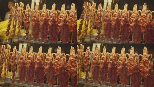 陕西西安回民街美食大鱿鱼升格慢镜高清在线视频素材下载