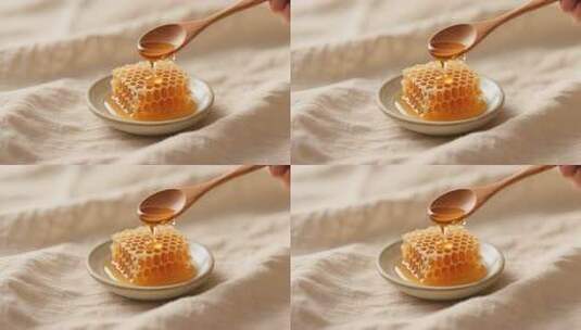 木勺舀蜂蜜滴在蜂巢蜜上高清在线视频素材下载