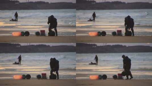 黄昏时分海边沙滩上赶海的老渔民高清在线视频素材下载