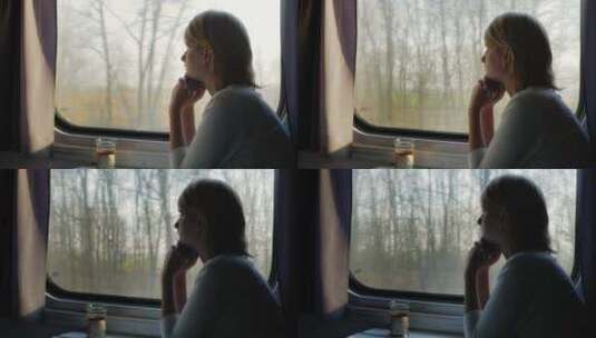 女人坐在火车车窗旁望向车外高清在线视频素材下载