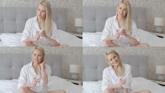 女人坐在床上喝咖啡高清在线视频素材下载