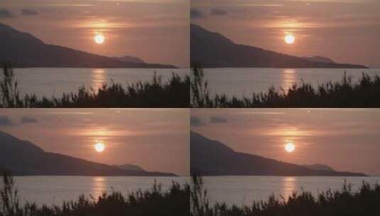 海岸上的红色夕阳高清在线视频素材下载