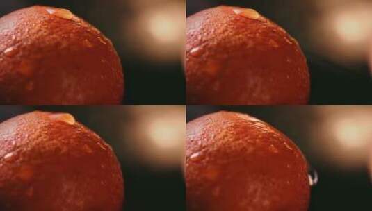 橙子皮上水珠滚下高清在线视频素材下载