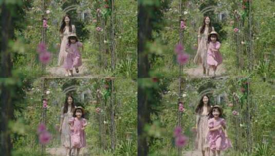 妈妈跟女儿在万花丛中开心地奔跑高清在线视频素材下载