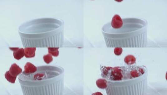 树莓掉入水杯中的慢镜头高清在线视频素材下载