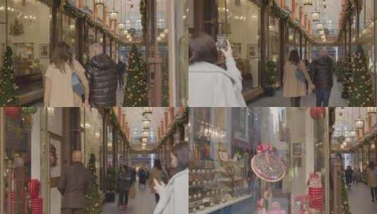 女人在商场拍摄一对夫妻背影高清在线视频素材下载