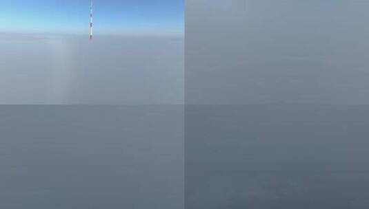 拉脱维亚里加广播电视塔的鸟瞰图——欧盟最高的塔，在一个多云的冬天早晨。塔部分被厚厚的云层覆盖。高清在线视频素材下载