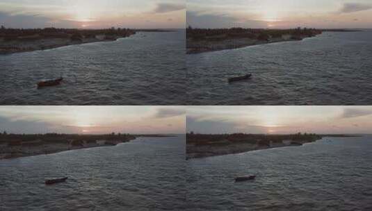 夕阳下在海上漂流的船高清在线视频素材下载