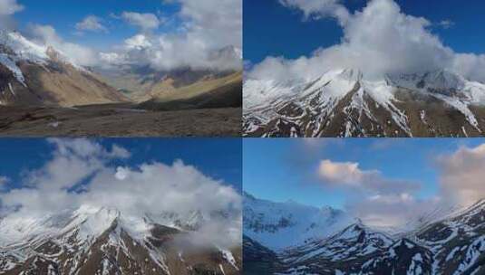 雪山顶上云层飘动高原雪山蓝天白云延时摄影高清在线视频素材下载