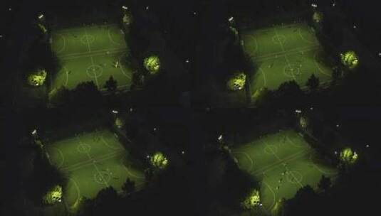 航拍夜晚足球场踢足球比赛高清在线视频素材下载