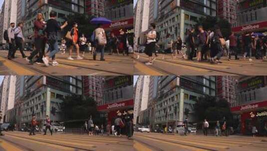 俯拍香港街道红绿灯过马路实拍视频4K高清在线视频素材下载