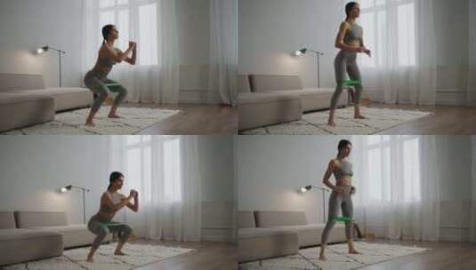 早上在家锻炼年轻漂亮的女人腿上戴着健身带高清在线视频素材下载