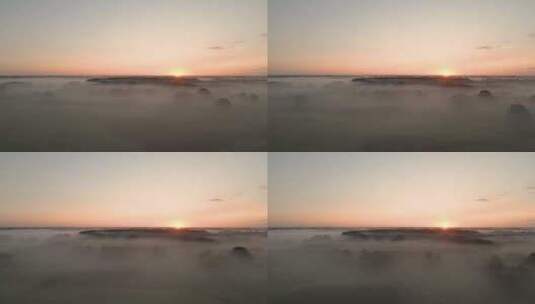 航拍日出时被大雾笼罩的平原城市高清在线视频素材下载