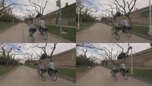 男人和女人在自行车道上一起骑自行车高清在线视频素材下载