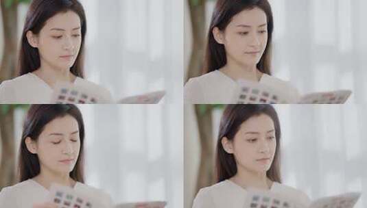 女性居家阅读杂志画面高清在线视频素材下载