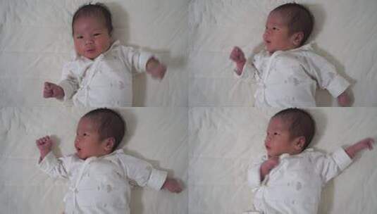 床上平躺的新生儿高清在线视频素材下载