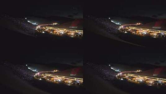 敦煌市月牙泉夜晚场地灯光秀空中俯拍画面高清在线视频素材下载