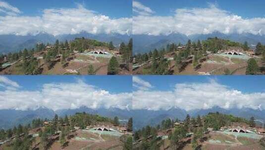 阿鲁腊卡山间建筑与森林雪山景观高清在线视频素材下载
