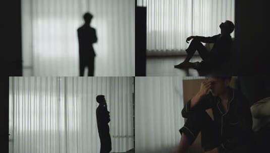 男子压力大窗前剪影高清在线视频素材下载