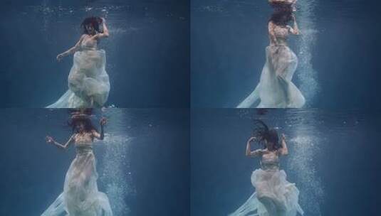 水下摄影：人物在阳光照射下的潜水瞬间高清在线视频素材下载