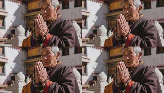 西藏老人寺庙前虔诚祈祷高清在线视频素材下载