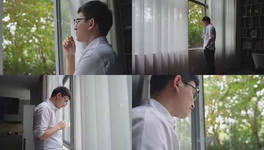 男子思考窗边抽烟高清在线视频素材下载