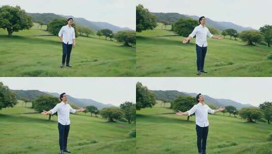 男子于草地眺望远方高清在线视频素材下载