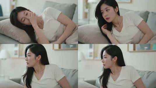 居家女子沙发上的侧坐画面高清在线视频素材下载