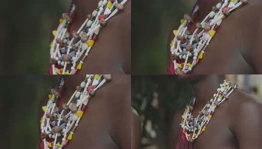 非洲坦桑尼亚色非洲马赛人穿传统服装跳舞唱歌彩斑斓的珠饰项链特写高清在线视频素材下载