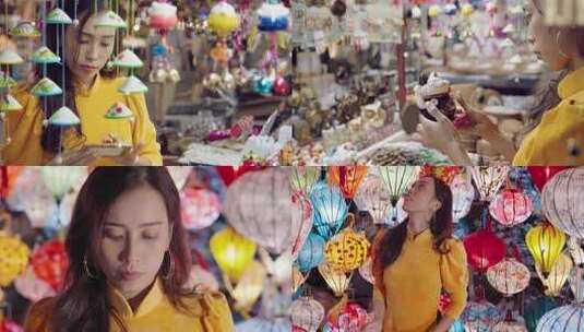 女子在集市挑选手工艺品高清在线视频素材下载