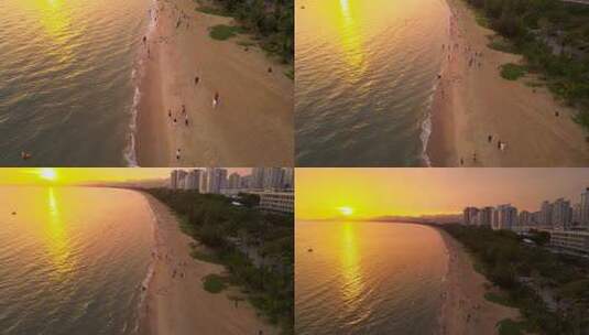 海南省三亚市三亚湾耶梦长廊沙滩上的游客高清在线视频素材下载