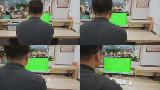 男子在绿色屏幕的电脑前办公 背影高清在线视频素材下载