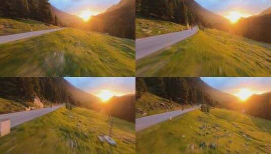 FPV航拍日出阳光绿色森林公路上骑行摩托车高清在线视频素材下载