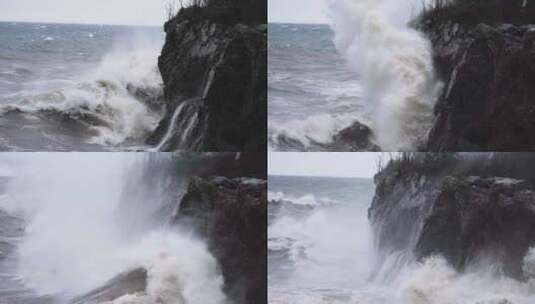 汹涌的风浪以慢动作撞击花岗岩海岸悬崖高清在线视频素材下载