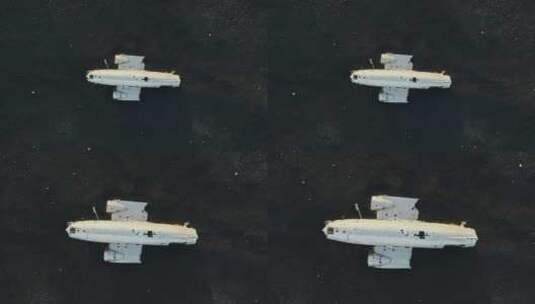 无人机驶向黑沙中的飞机残骸高清在线视频素材下载