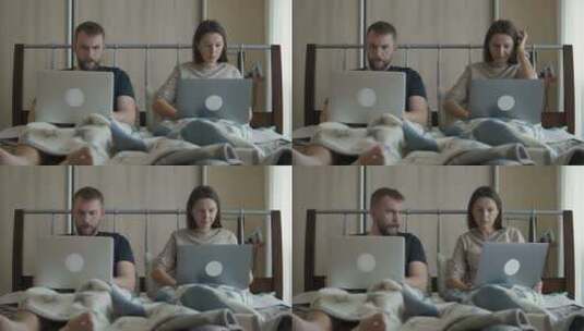 床上情侣使用笔记本电脑高清在线视频素材下载