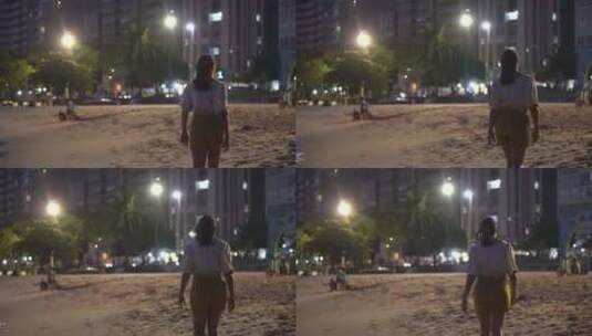 傍晚走在沙滩上的孤单女孩背影高清在线视频素材下载