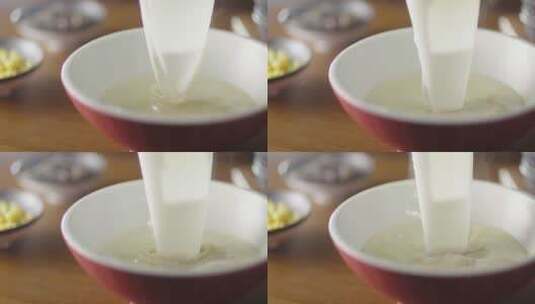 2K高速摄影一大勺汤倒入碗中特写高清在线视频素材下载