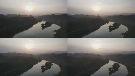 航拍大山河流日落夕阳剪影高清在线视频素材下载
