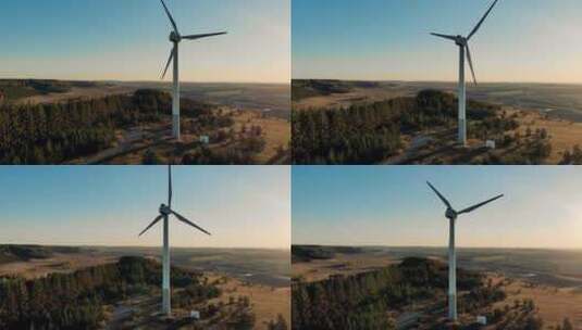 在日落背景下工作的风力涡轮机高清在线视频素材下载