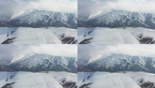 航拍风雪中的洛隆县雪山风光高清在线视频素材下载