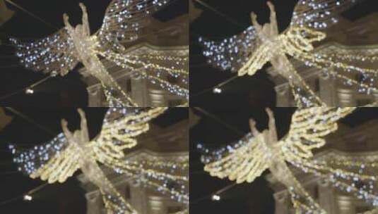 伦敦英国摄政街商店的天使圣诞灯装饰夜景特写高清在线视频素材下载
